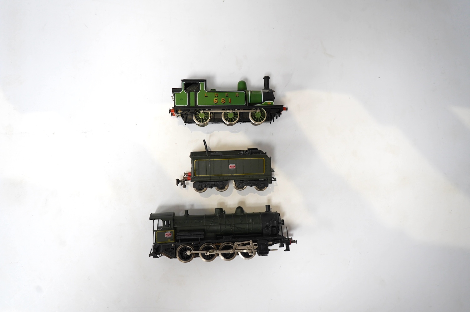 A quantity of Marklin, etc. HO gauge model railway including three locomotives; a boxed rail bus, an SNCF 2-8-0 loco (missing front pony truck), and an LNER 0-6-0T, together with street lighting, freight wagons, a trust